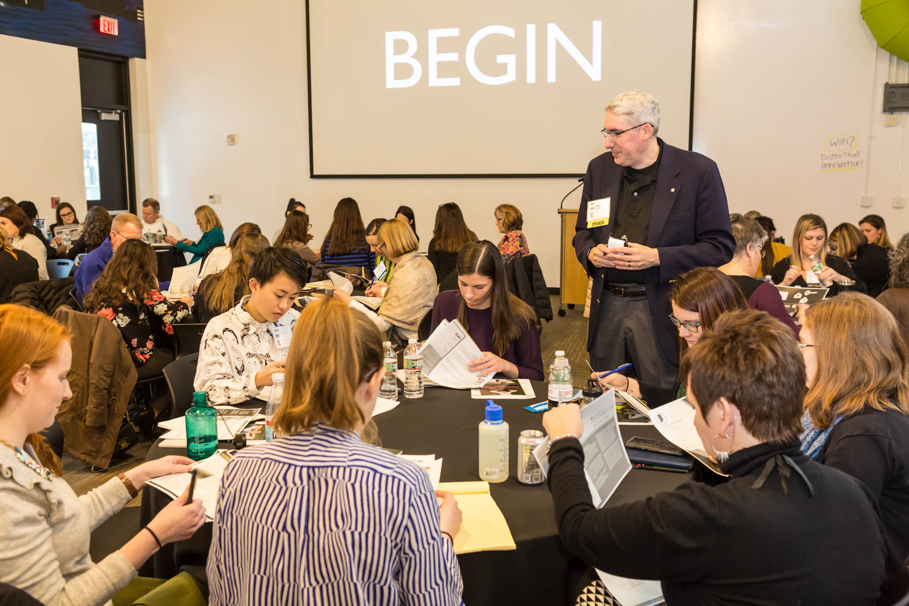 Matt Handal teaching a workshop with participants seated around tables